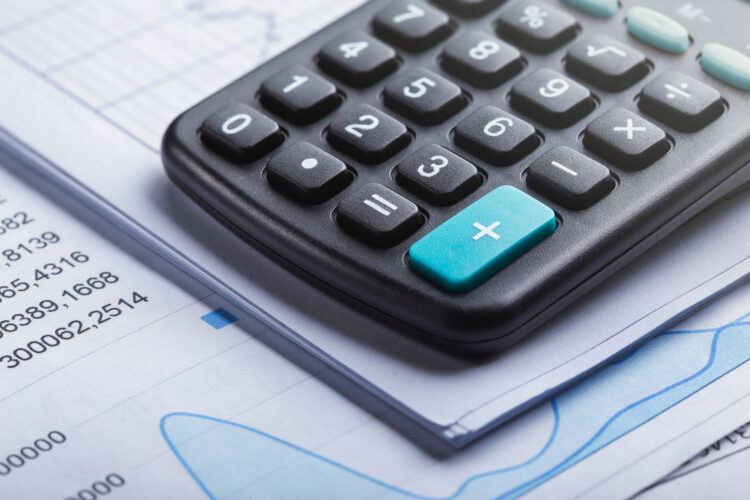 calculator and accounting document. Concept of banking, financial report and financial audit.