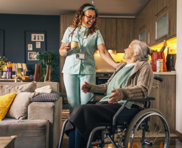 a nurse visits an elderly disabled woman at home and helps her